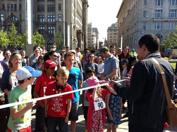 cutting the ribbon at the start of the Walk for Freedom