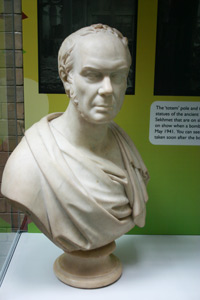 White marble bust of a man's head and shoulders