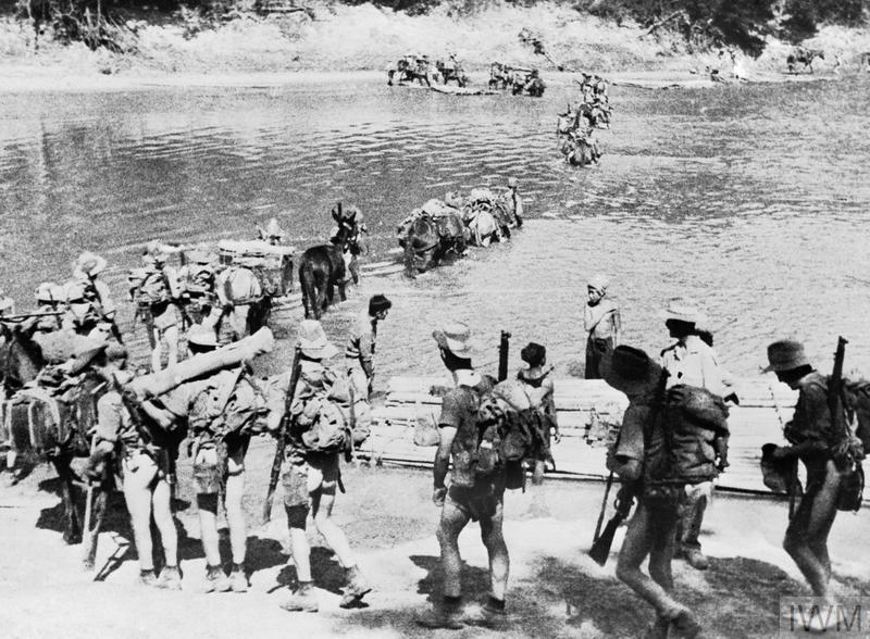 Line of soldiers crossing a river