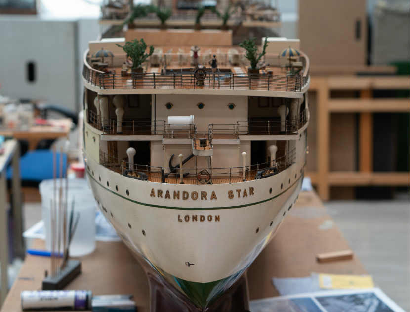 detail of name 'Arandora Star, London' on ship model, cleaner and newer looking than in earlier photo