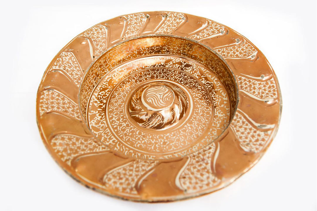 Patterned ceramic dish with lustre finish gold colours