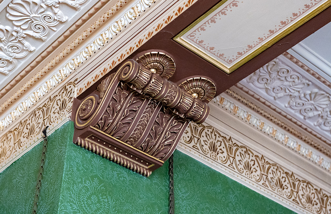 Moulded plater ceiling and stencilled frieze, white and gold