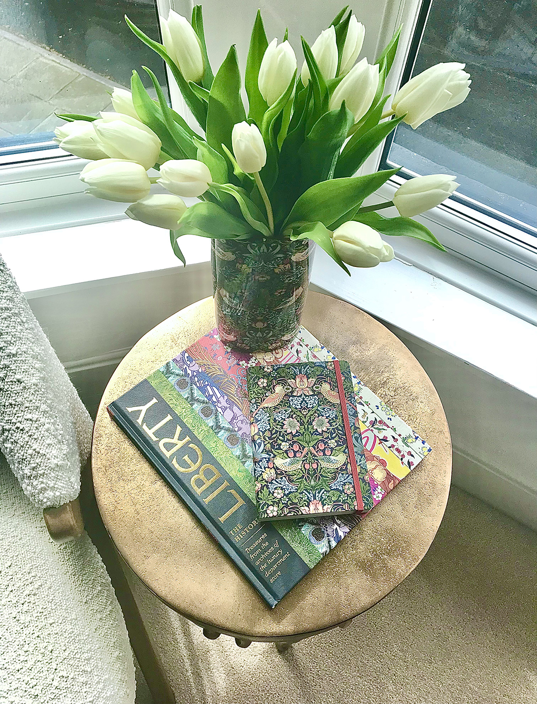 Liberty multicoloured book on table with tulips