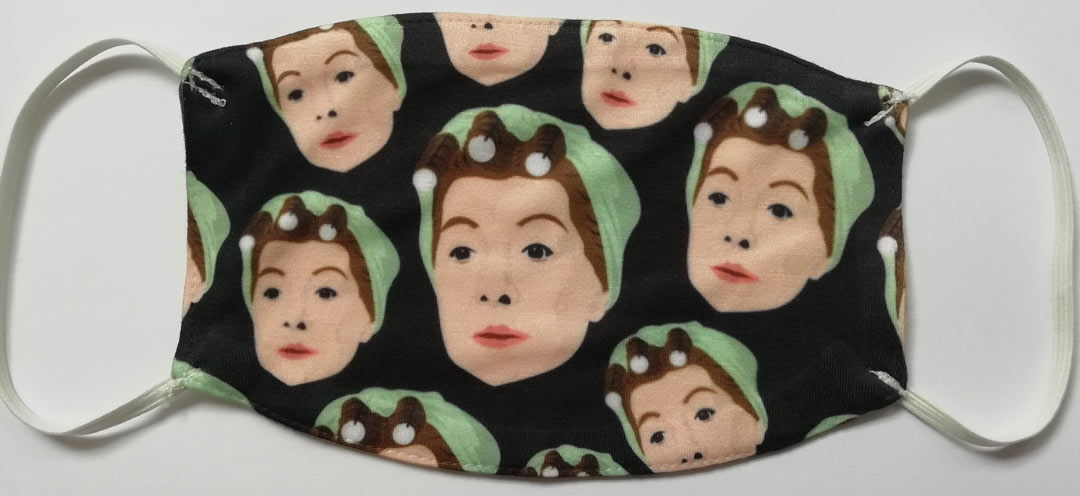 facemask with repeated pattern of Hilda Ogden's head, wearing rollers and a headscarf