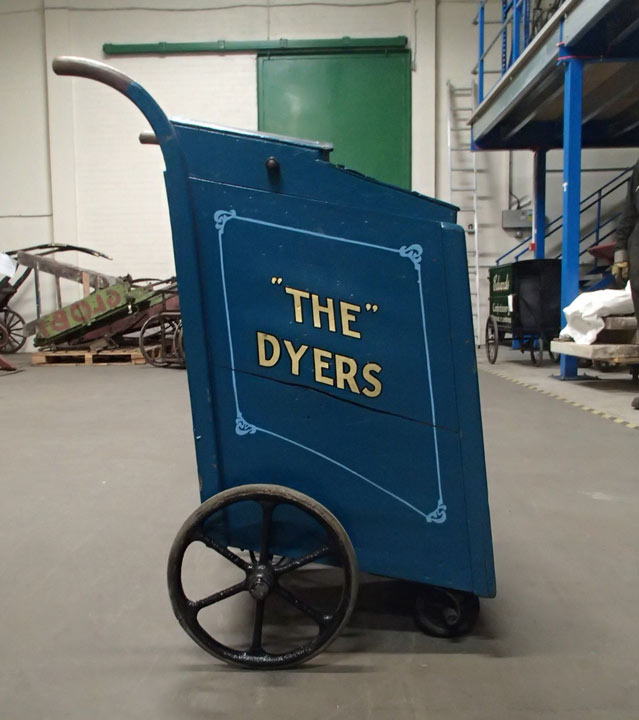 handcart with 'The Dyers' in gold letters on the side