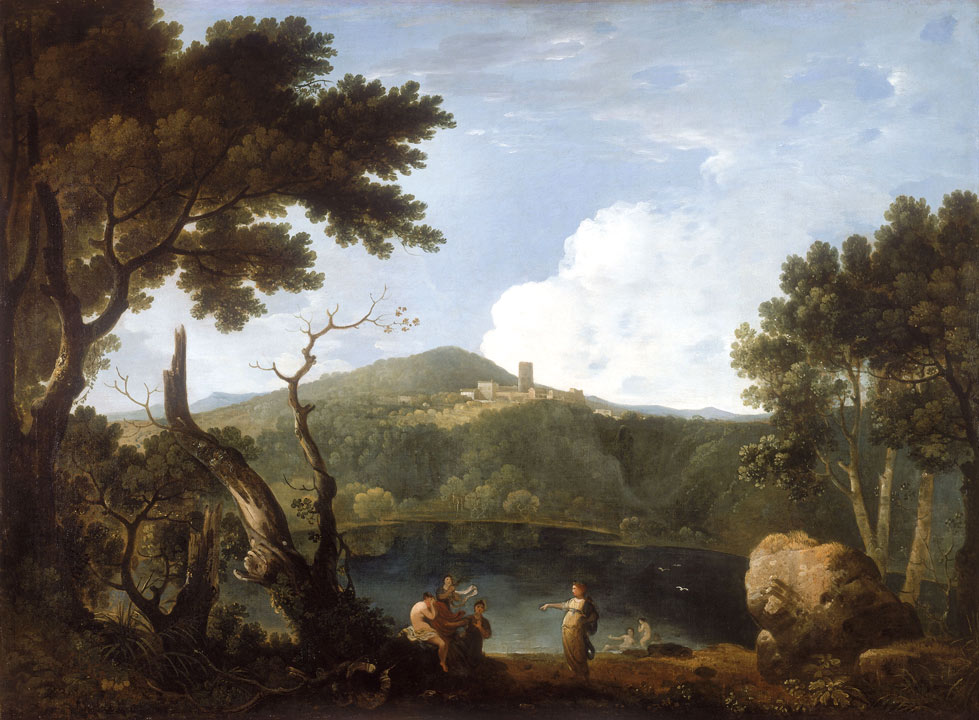 small group of women on the shore of a lake, with mountains in the background