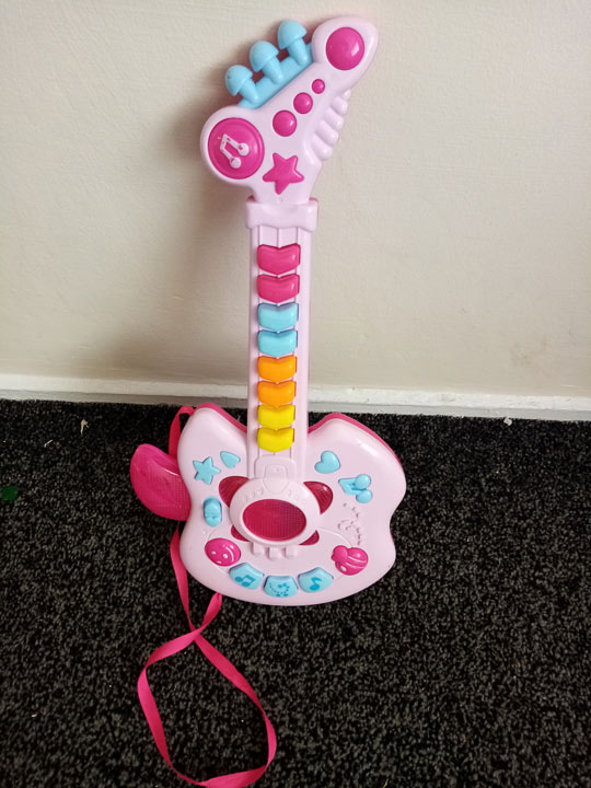 pink toy guitar