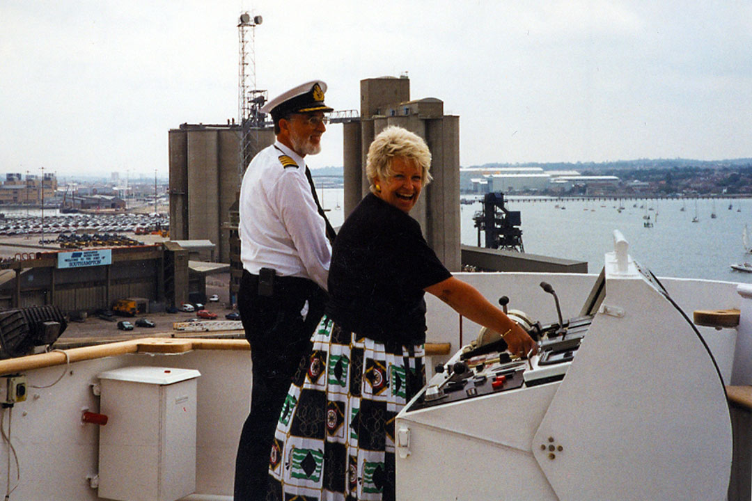 Lynn Littler on the deck of the QE2 with the captain