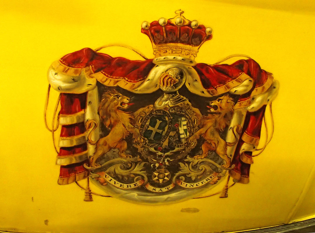 coat of arms on a yellow coach