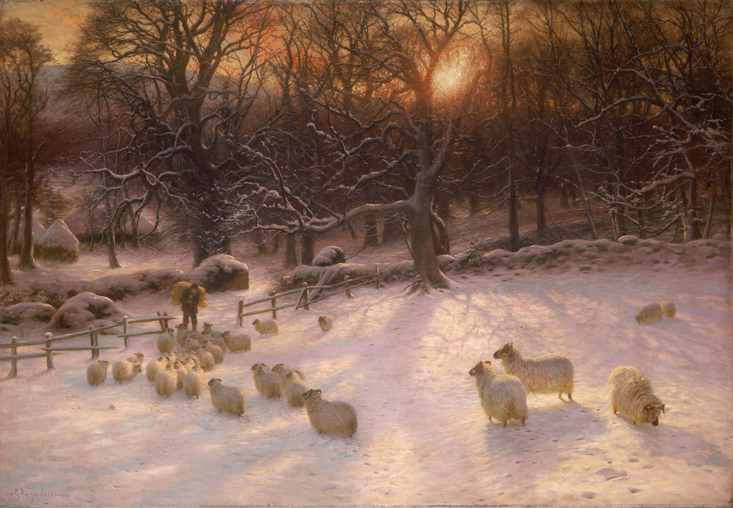 sheep in a snowy field at sunset