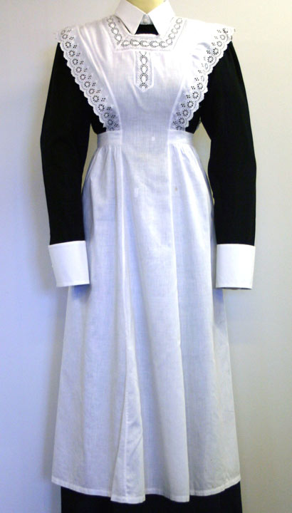 long white lace trimmed apron on a mannequin