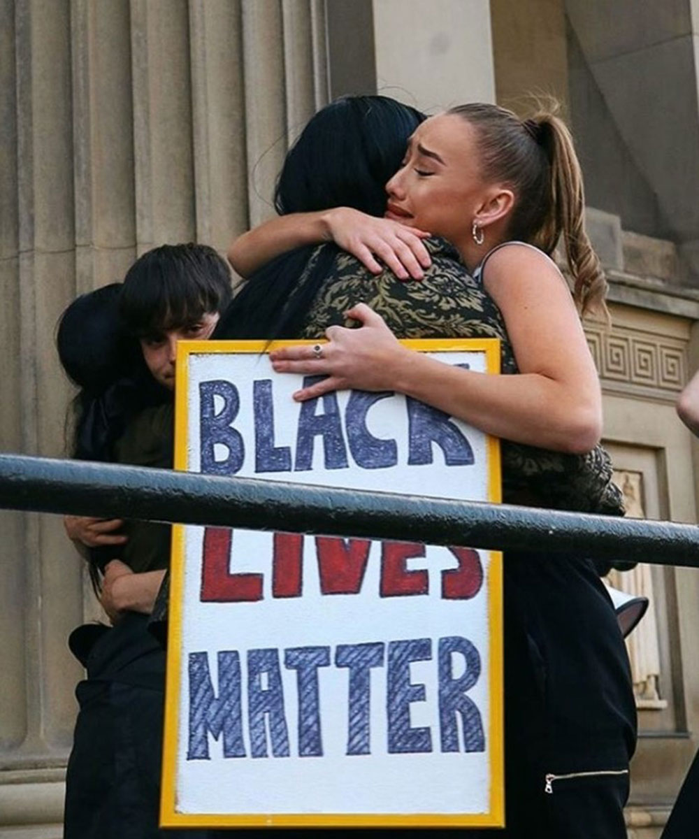 Emily Kenright holding her BLM protest sign 