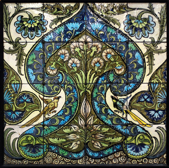 tile panel with floral design, symmetrical apart from 2 birds