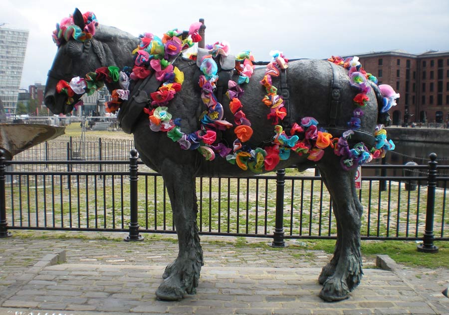 working horse sculpture covered in flowers