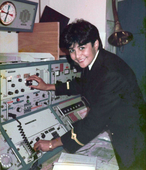 Fazilette operating a radio control board on a ship