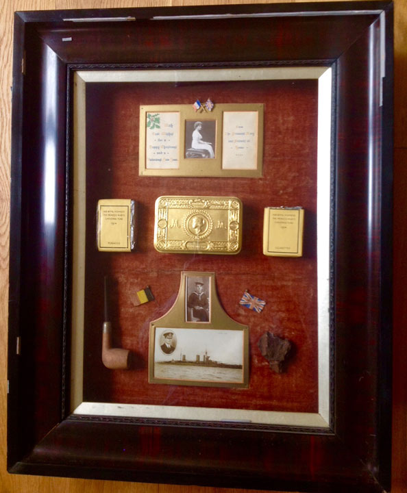 various gift items in a thick wooden frame