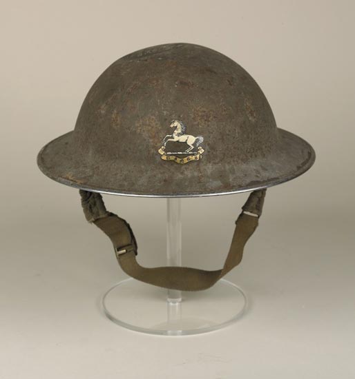 Soldier's helmet with King's Regiment badge