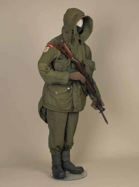 soldier's uniform and rifle, displayed on mannequin