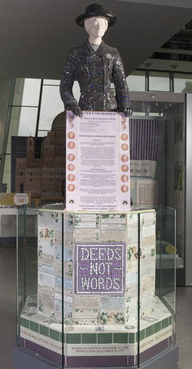 sculpture of Mary Bamber holding a Votes for Women placard