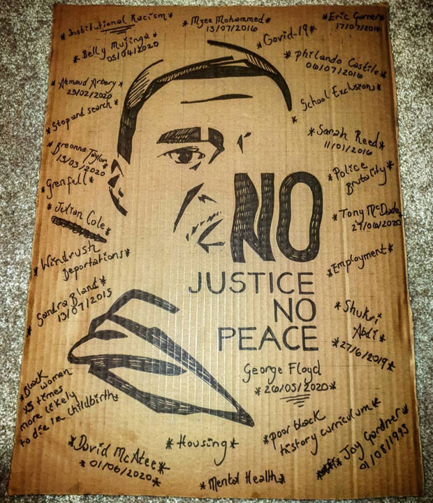 Placard with drawing of George Floyd and protest messages