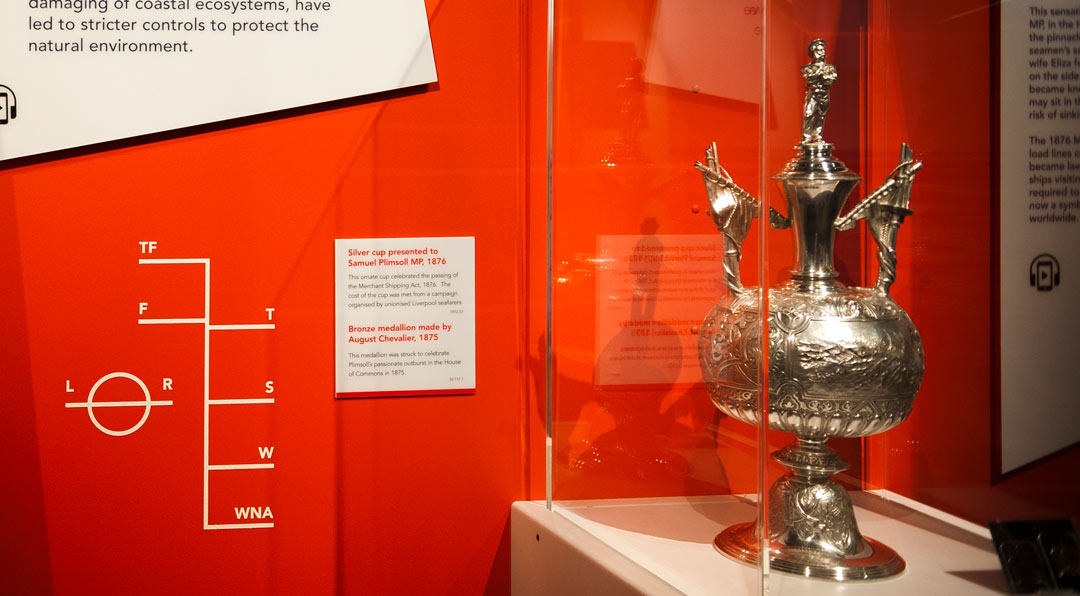 silver trophy in museum display with Plimsoll Line on wall