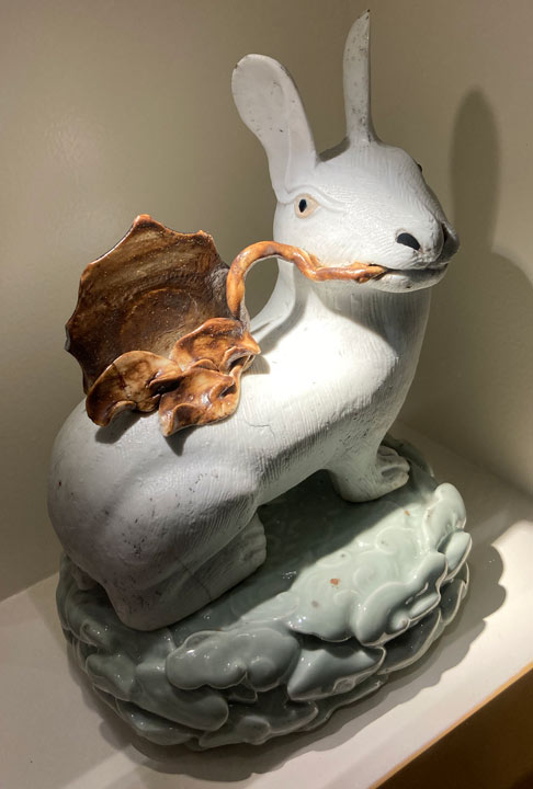 ceramic rabbit chewing lettuce