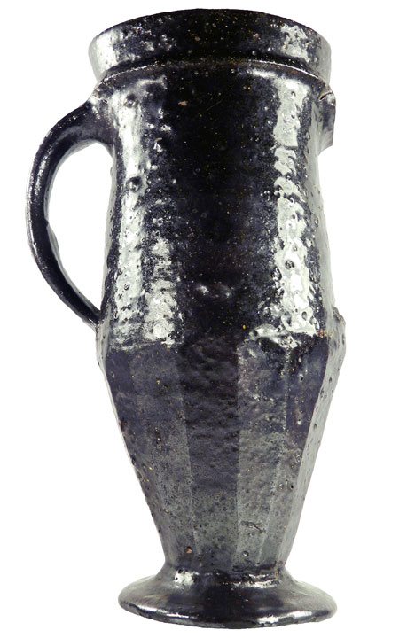 tall pottery cup with handle and flared base
