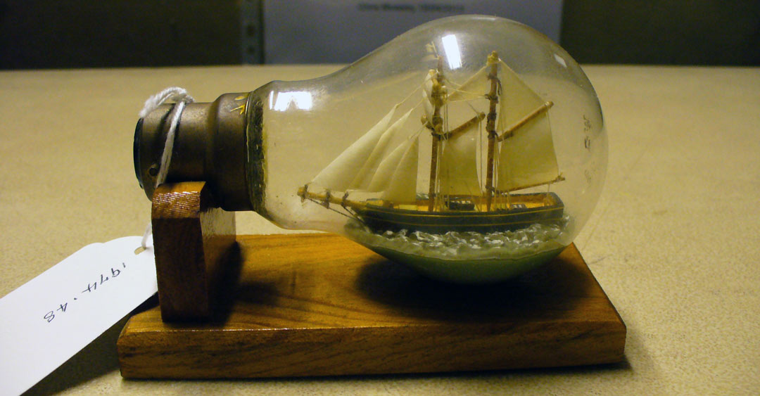 tint model sailing ship in a lightbulb