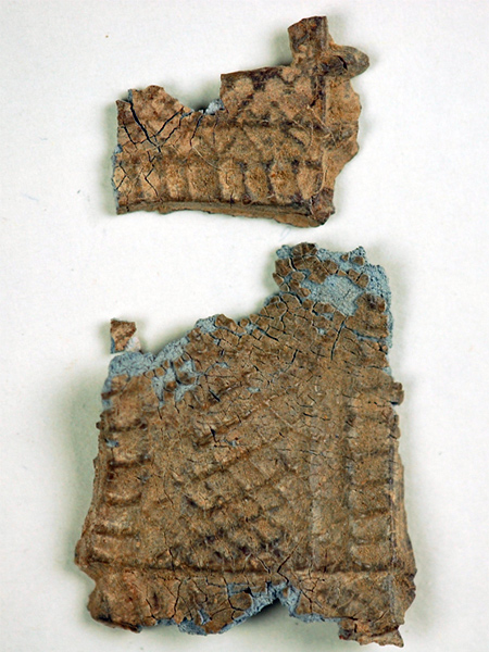 Two main fragments of a decorative plaque from a votive offering associated with the Sanctuary of Artemis Orthia.