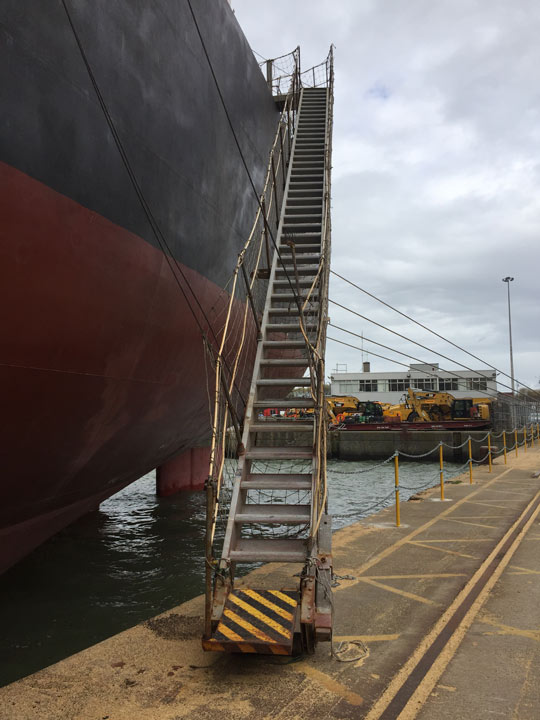steps leading up to a ship in dock
